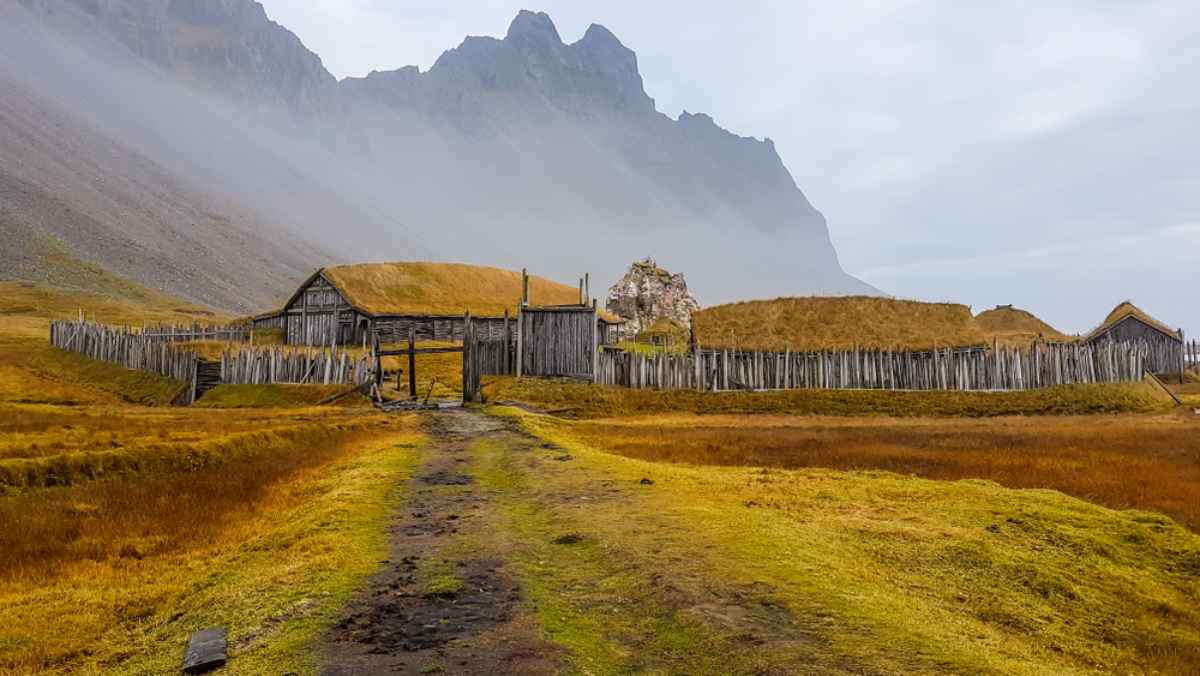 Viking village in Iceland with rugged mountains and moss