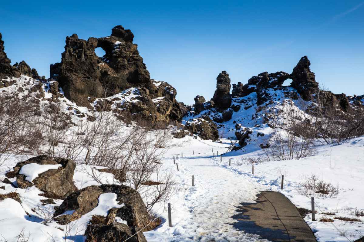 Dimmuborgir in winter with snow contrasting with the dark lava rock