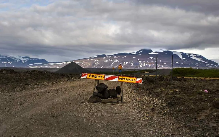 A road in Iceland blocked by a sign reading 