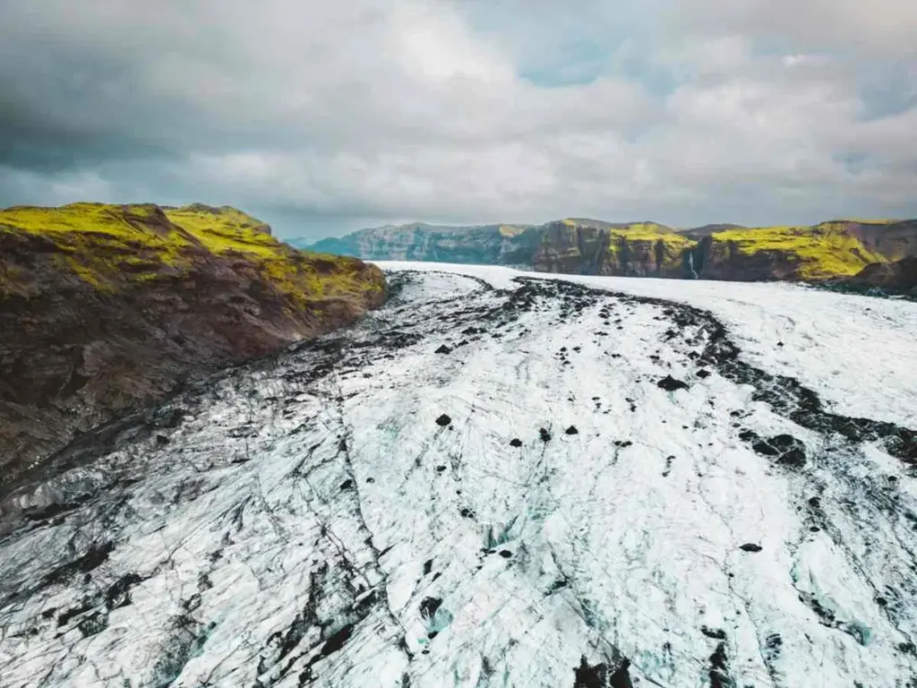 Langjökull Glacier in Iceland, showcasing the vast icy landscape under a clear blue sky.