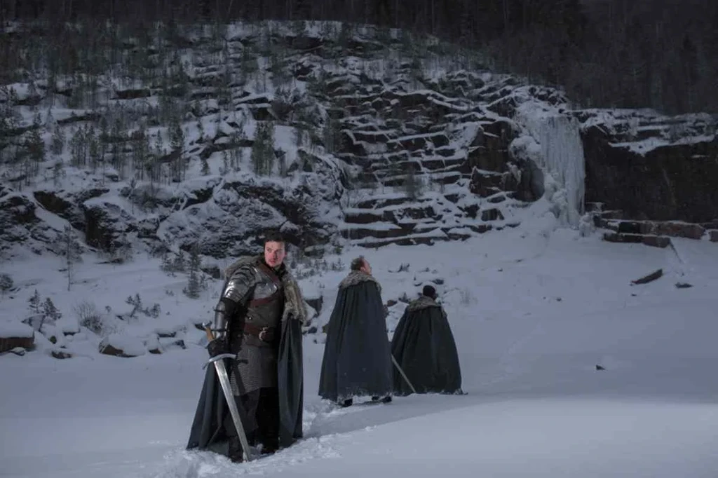 Medieval warriors in snow-covered landscape, resembling a scene from Game of Thrones, filmed in Iceland.