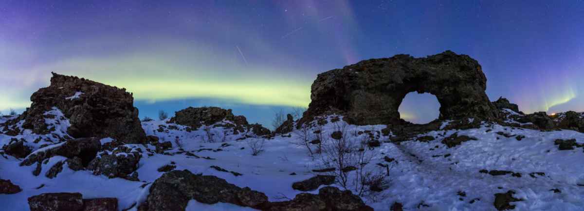 Northern lights dancing over Dimmurborgir, North Iceland