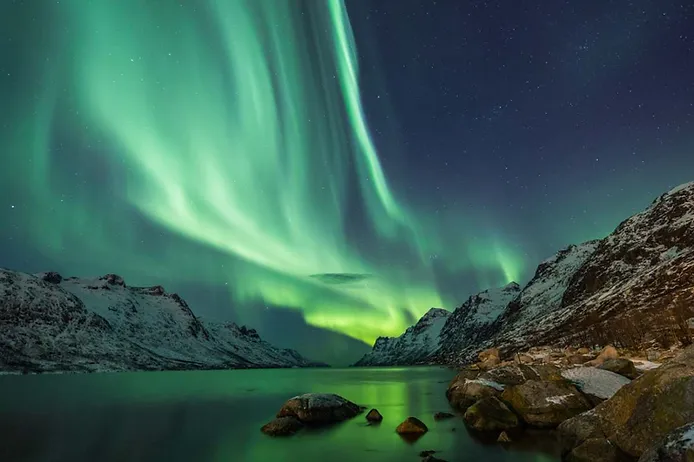 Northern lights shining on an Icelandic Fjord