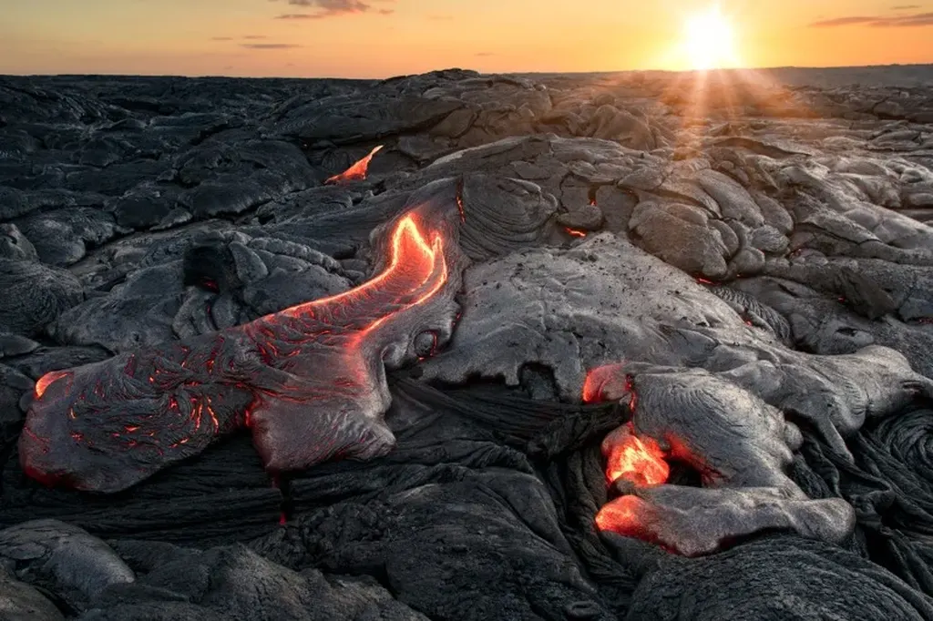 Molten lava from the Laki eruption in Iceland, slowly cooling under the setting sun, highlighting the dramatic landscape shaped by volcanic activity.