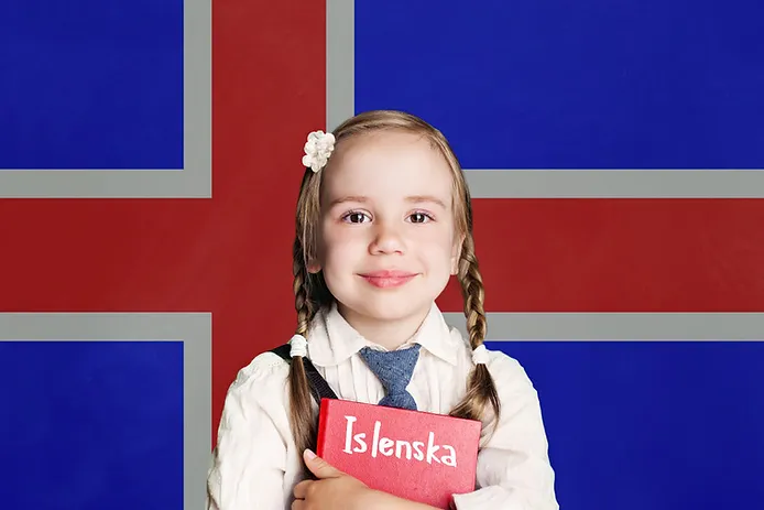 Little girl holding her Icelandic workbook with the Icelandic flag behind her 