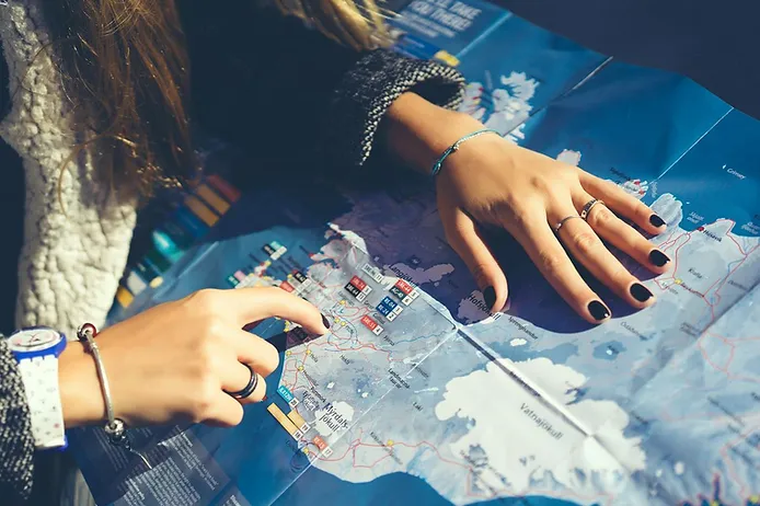 Driver checking a map of Iceland