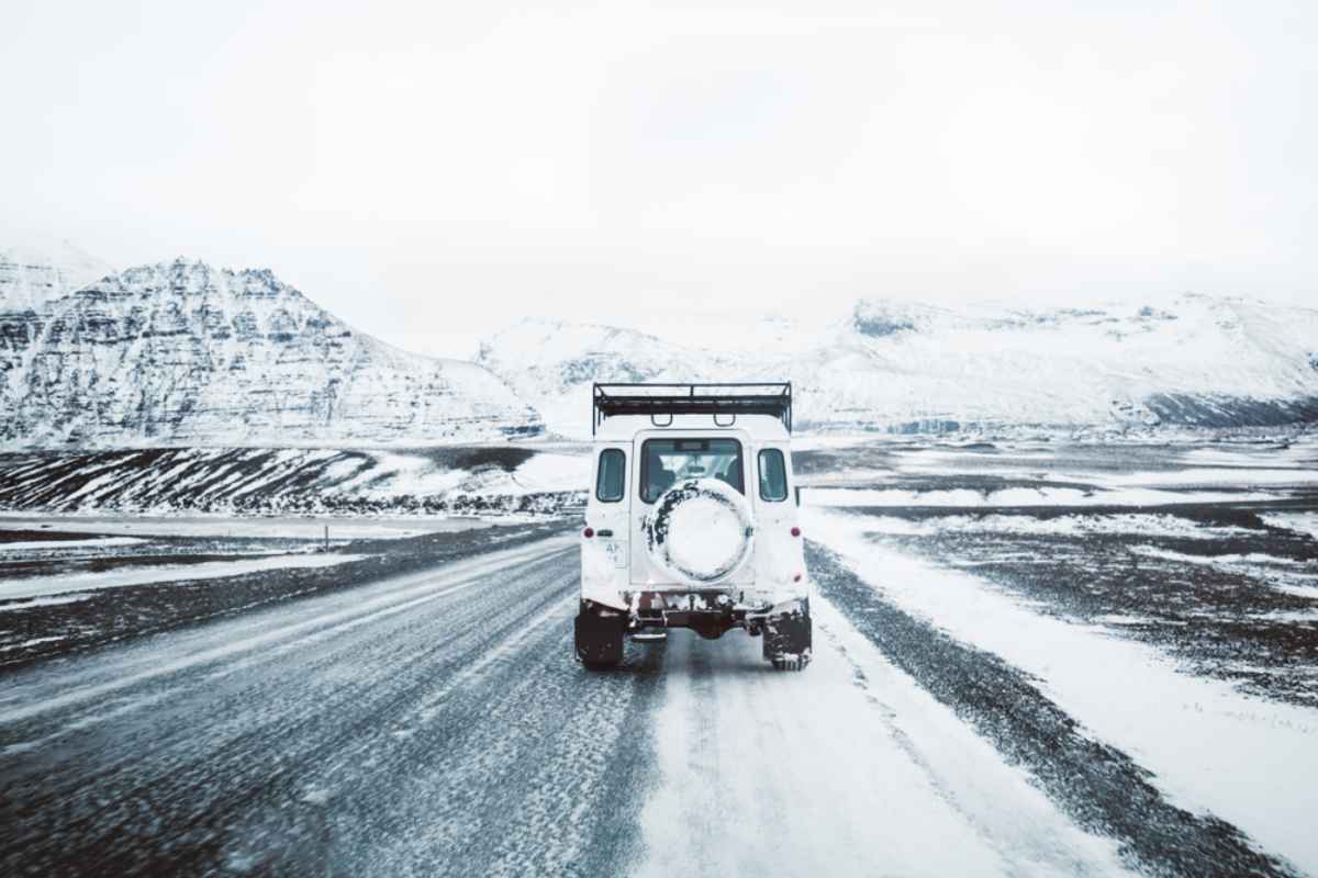 Rental car with winter tires while driving on a snow covered road