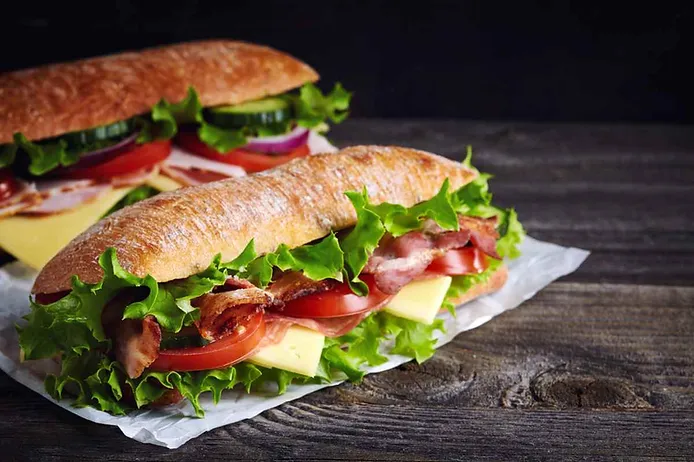 A pair of Subway sandwiches