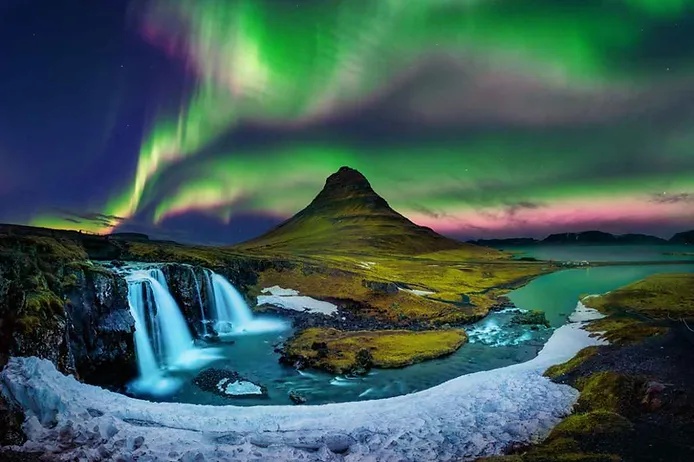 Kirkjufell mountain with northern lights shining above