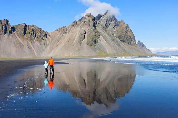 Family visiting Vestrahorn in Iceland