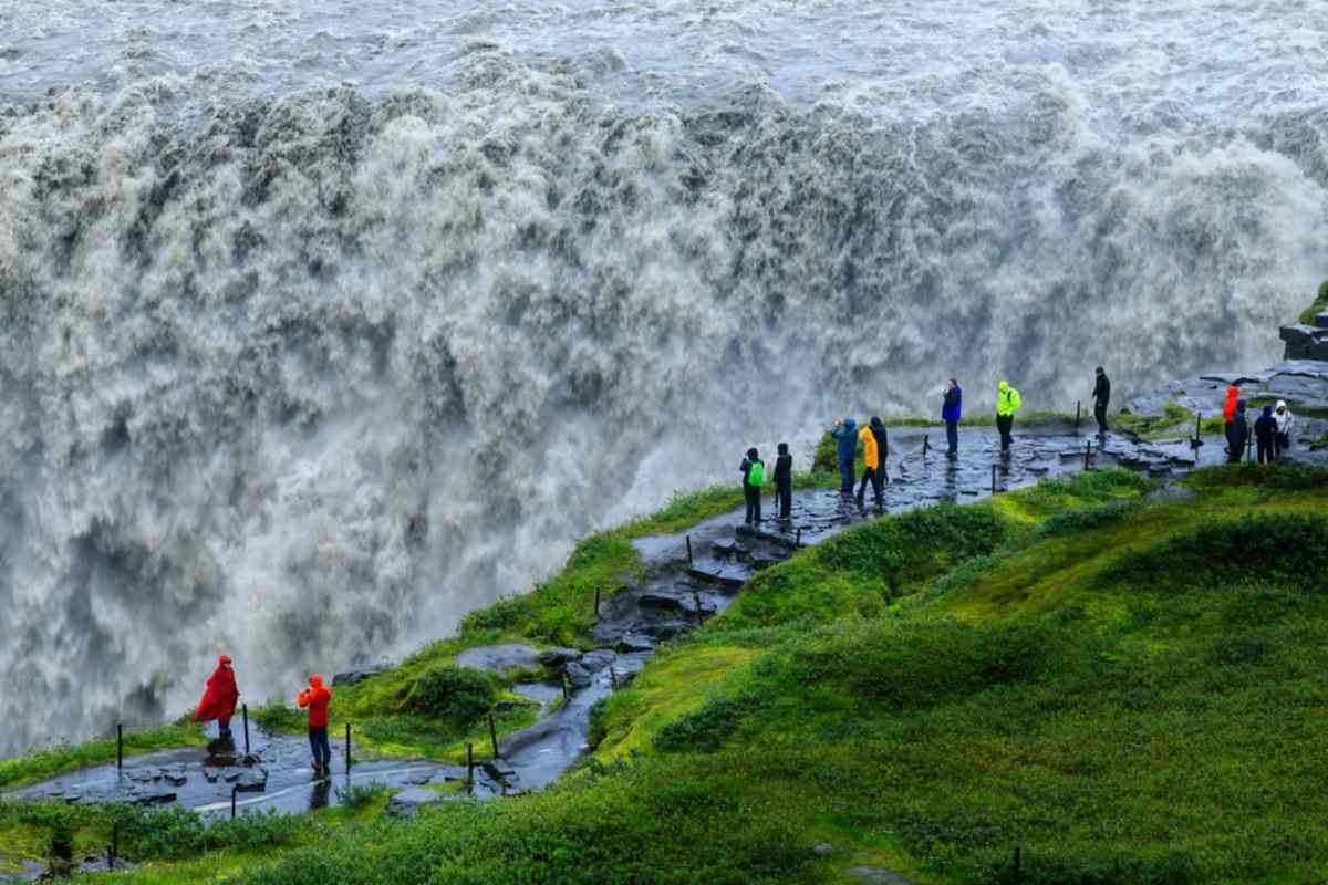 Visitors enjoying the powerful waters of Dettifoss