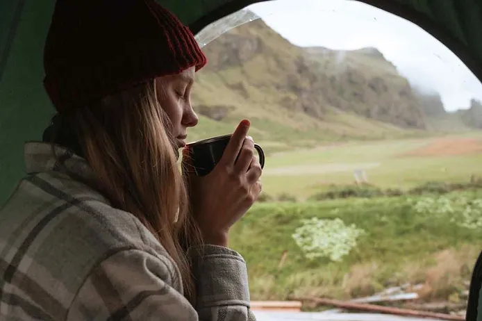 Girl camping in Iceland