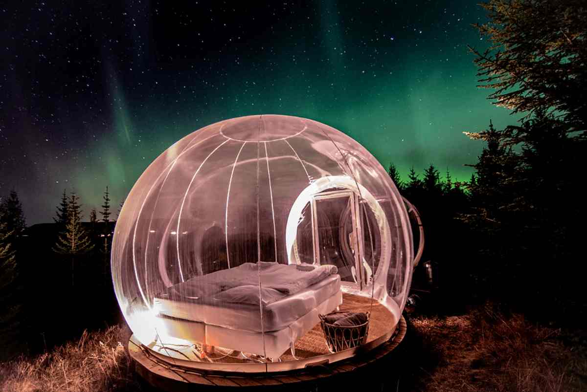 Bubble hotel with the Northern Lights in the background