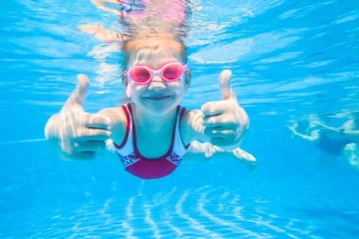 Girl swimming in a pool in Reykjavik