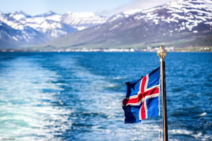 Icelandic flag waving on an Icelandic boat - Ferry routes in Iceland