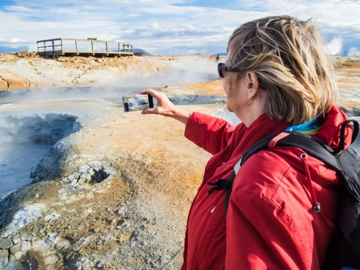 Tourist using their mobile in Iceland