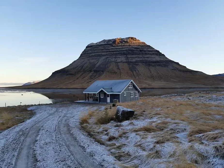 Álfasteinn cabin on the Snæfellsnes Peninsula, Iceland, set near Kirkjufell mountain, offering scenic views and modern amenities for a relaxing stay.