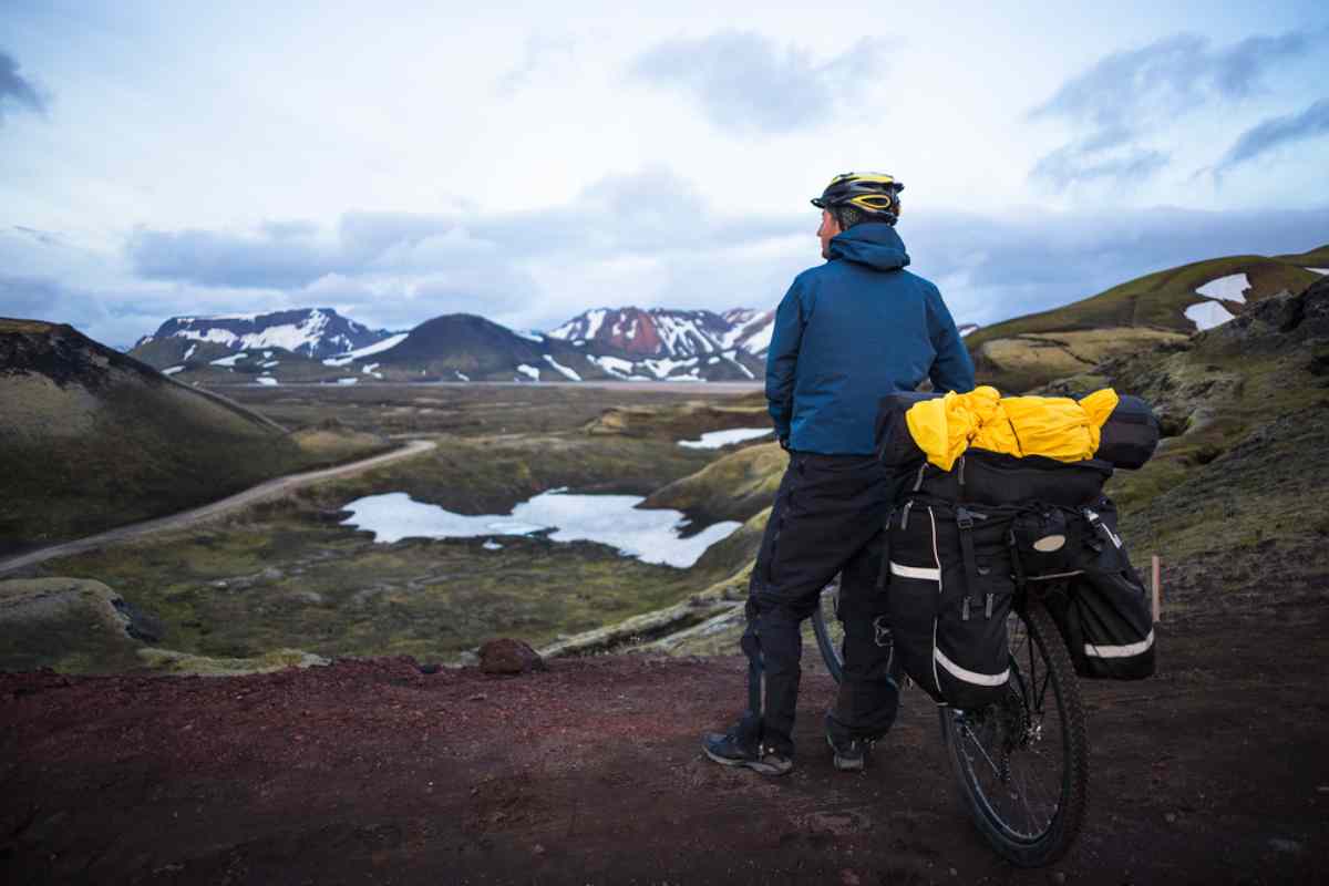 Man with his bike enjoying the views of the Icelandic landscape