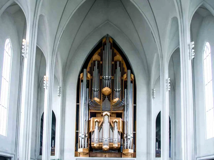 The impressive pipe organ inside Hallgrimskirkja Cathedral in Reykjavik, Iceland, showcasing its intricate design and towering structure.