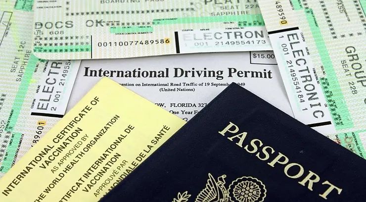 Documents required for car rental in Iceland, including an international driving permit, passport, boarding passes, and an international vaccination certificate.