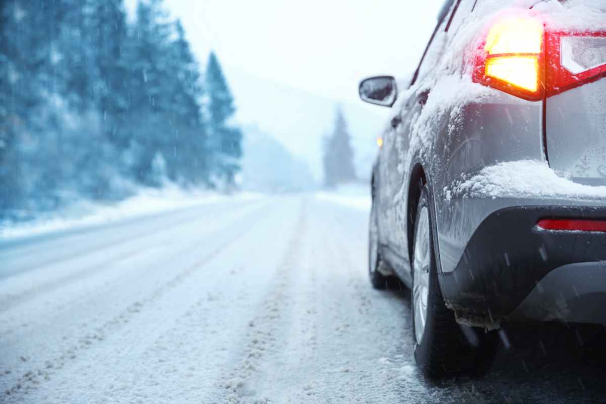 views of a snowy road from the underside of a vehicle