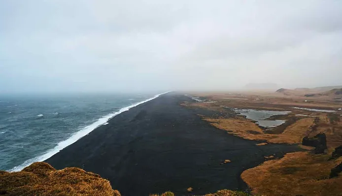 Views of a black beach in Iceland from a cliff